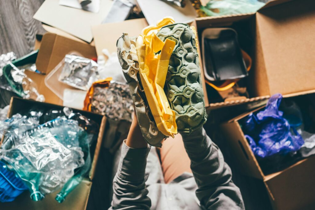 Woman sorting different waste.